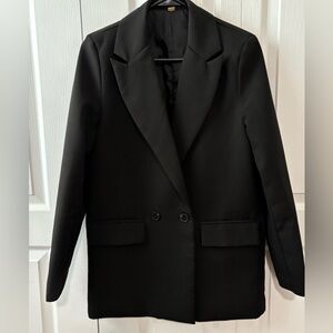 Women’s black lined blazer with pockets. Small. Brand tag cut off.